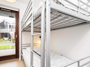 a bedroom with bunk beds in a house at Apartment Bogense LXI in Bogense