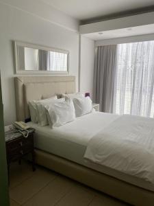 מיטה או מיטות בחדר ב-Milord Hotel