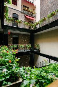 an apartment building with plants on the balconies of it at The Broome in New York