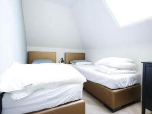 Ліжко або ліжка в номері Nice villa in Wieringer style near the Wadden Sea