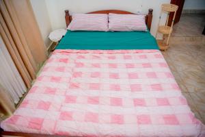 Ένα ή περισσότερα κρεβάτια σε δωμάτιο στο Nazareth Guest House