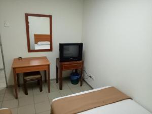 TV a/nebo společenská místnost v ubytování SHA LA LA