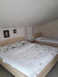 Postel nebo postele na pokoji v ubytování Apartments Vesna