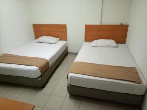Postel nebo postele na pokoji v ubytování SHA LA LA