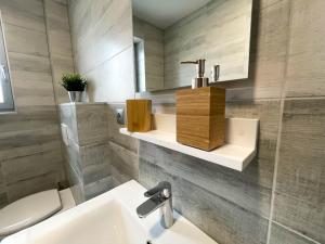 Kúpeľňa v ubytovaní Apartmány Katalin