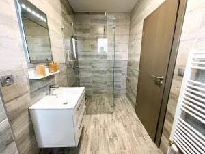 Kúpeľňa v ubytovaní Apartmány Katalin