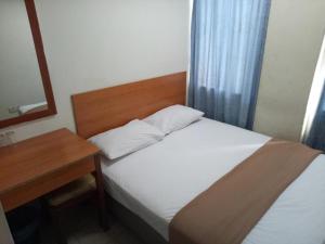 Postel nebo postele na pokoji v ubytování SHA LA LA