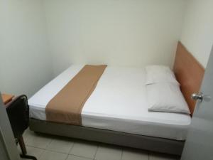 Postel nebo postele na pokoji v ubytování SHA LA LA