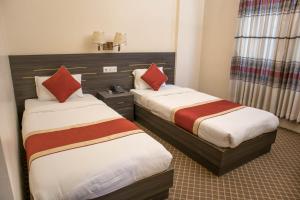 Ένα ή περισσότερα κρεβάτια σε δωμάτιο στο Mirage Inn