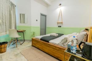 Postel nebo postele na pokoji v ubytování Moustache Udaipur