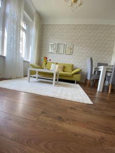 a living room with a couch and a table at Villarheinblick in Kamp-Bornhofen