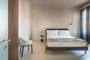 A bed or beds in a room at Byssus Suites