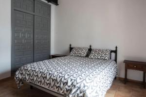 A bed or beds in a room at la Alhábega