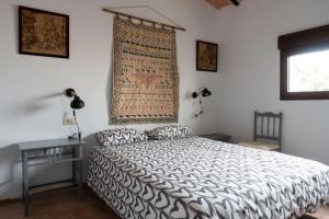 A bed or beds in a room at la Alhábega