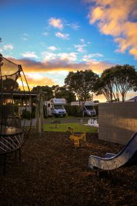 a park with a playground with a slide at New Plymouth TOP 10 Holiday Park in New Plymouth