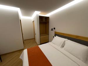 Ένα ή περισσότερα κρεβάτια σε δωμάτιο στο MIST Boutique Hotel