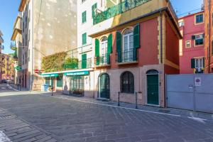 an empty street in a city with buildings at Lux by PortofinoHomes in Santa Margherita Ligure