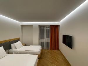 Ένα ή περισσότερα κρεβάτια σε δωμάτιο στο MIST Boutique Hotel