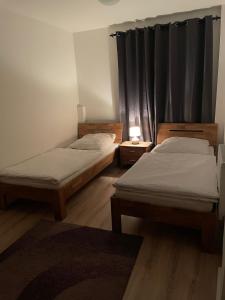 Postel nebo postele na pokoji v ubytování Idylle auf dem Reiterhof bei Husum