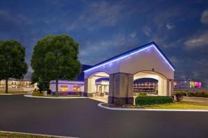a building with a blue light on the side of it at Days Inn by Wyndham Austintown in Austintown