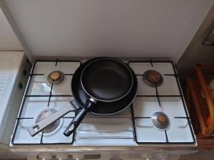 a pot on top of a stove in a kitchen at Casa Ferrini in Marciana