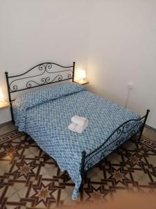 Posteľ alebo postele v izbe v ubytovaní La casedda di via pepe