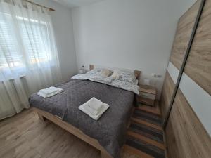 Posteľ alebo postele v izbe v ubytovaní Šimun