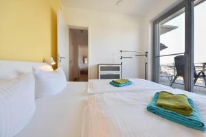 Ένα ή περισσότερα κρεβάτια σε δωμάτιο στο Penthouse West