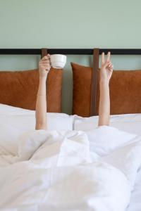 A bed or beds in a room at La Farine Rooms