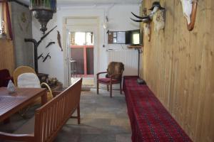 TV a/nebo společenská místnost v ubytování Idylle auf dem Reiterhof bei Husum