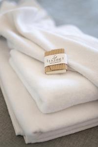 A bed or beds in a room at La Farine Rooms