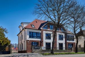 a large brick house with a red roof at Penzión Skalica in Skalica