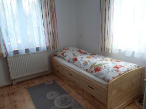a small bedroom with a bed with a pillow on it at Ferienwohnung Funk in Langenargen