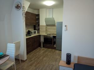 Cucina o angolo cottura di Szellőrózsa Apartman