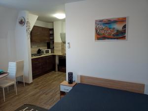 Cucina o angolo cottura di Szellőrózsa Apartman
