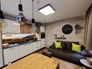 A kitchen or kitchenette at DaHome Appartements