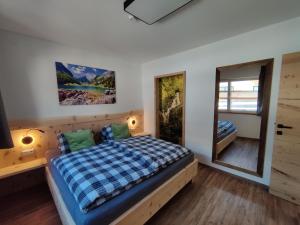 A bed or beds in a room at DaHome Appartements