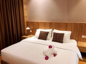 Postel nebo postele na pokoji v ubytování Imperial Grand Suite Apartment Kuching