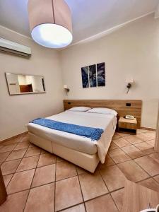 Postel nebo postele na pokoji v ubytování Albergo Africa