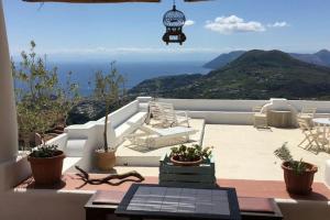 a patio with a view of the ocean at Villa Paradiso in Piano Conte