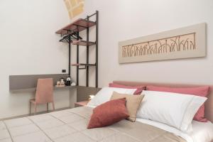 Postel nebo postele na pokoji v ubytování Michelangelo B&B
