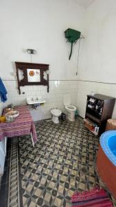 a bathroom with two toilets and a table and a sink at La Antigua Casa Terrén in Solís +47 photos