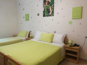מיטה או מיטות בחדר ב-Albergo Stella