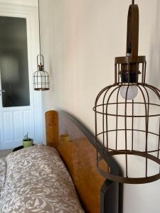 A bed or beds in a room at Il gallo di Eracle - Charming suites & rooms