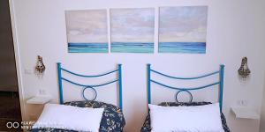 A bed or beds in a room at CASA PAOLINA NEL CENTRO DI BRACCIANO