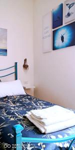 A bed or beds in a room at CASA PAOLINA NEL CENTRO DI BRACCIANO