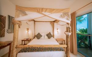 Ein Bett oder Betten in einem Zimmer der Unterkunft Sansi Kendwa Beach Resort