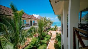 a view of the ocean from the balcony of a house at Sansi Kendwa Beach Resort in Kendwa