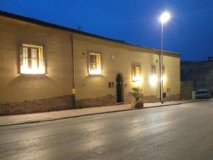 a building with a street light on the side of it at B&B Certe Notti in Agrigento