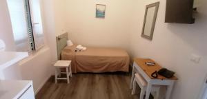 Postel nebo postele na pokoji v ubytování Hotel La Tavernetta